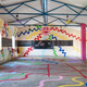 Image for article titled Japanese artists create stunning mud paintings on this Indian school’s walls—then wipe them off